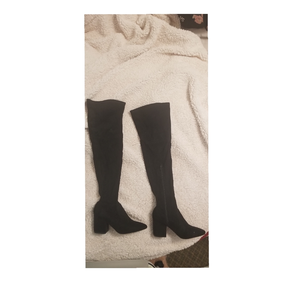 Black high knee boots.